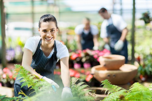 Professional landscaper designing a garden in Feltham